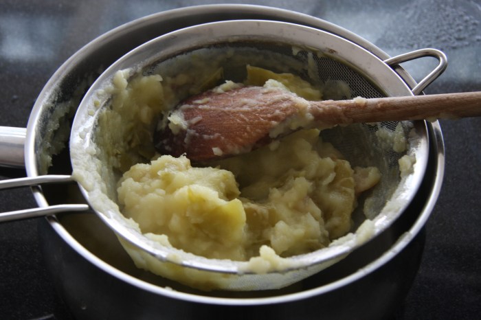 sieving cooked apples