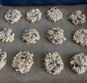 Unbaked mincemeat oatmeal raisin cookies on a baking tray before going into the oven